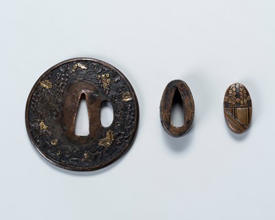 Lot 1472 - A SUAKA TSUBA WITH SCROLLING GRAPEVINES AND A MATCHING GILT-COPPER FUCHI AND KASHIRA WITH MILLET