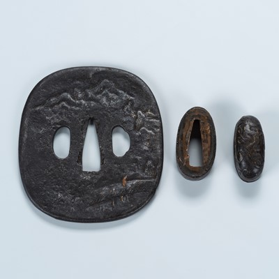 Lot 1511 - AN IRON TSUBA WITH A MAN CROSSING A BRIDGE, AN IRON FUCHI, AND AN IRON KASHIRA WITH A DRAGON