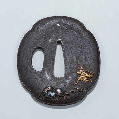 Lot 1469 - AN IRON TSUBA WITH A MAN CHASING A HORSE