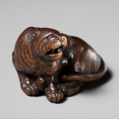 Lot 150 - ICHIMIN: A SUPERB WOOD NETSUKE OF A TIGER