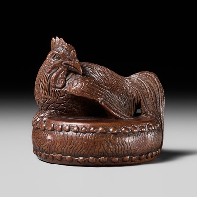 Lot 166 - TOMOKAZU: A FINE WOOD NETSUKE OF A COCKEREL ON A WAR DRUM