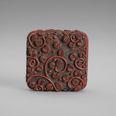 Lot 1751 - A FINE SQUARE TSUISHU LACQUER HAKO (BOX) NETSUKE WITH SCROLLING TENDRILS AND LEAVES