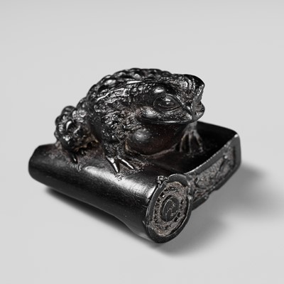 Lot 116 - MASANAO: A FINE EBONY WOOD NETSUKE OF A TOAD ON A ROOF TILE