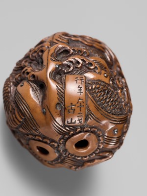 Lot 334 - TORYUSAI KOZAN: A SUPERB KURUMI (WALNUT) NETSUKE OF A DRAGON, DATED 1848