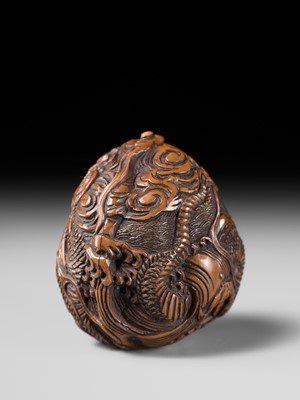 Lot 334 - TORYUSAI KOZAN: A SUPERB KURUMI (WALNUT) NETSUKE OF A DRAGON, DATED 1848