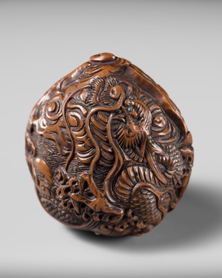 Lot 334 - TORYUSAI KOZAN: A SUPERB KURUMI (WALNUT) NETSUKE OF A DRAGON, DATED 1848