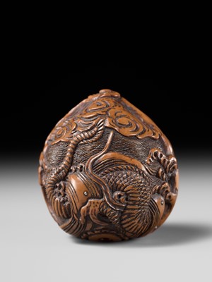 Lot 334 - TORYUSAI KOZAN: A SUPERB KURUMI (WALNUT) NETSUKE OF A DRAGON, DATED 1848