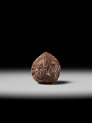 Lot 334 - TORYUSAI KOZAN: A SUPERB KURUMI (WALNUT) NETSUKE OF A DRAGON, DATED 1848