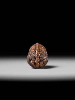 Lot 334 - TORYUSAI KOZAN: A SUPERB KURUMI (WALNUT) NETSUKE OF A DRAGON, DATED 1848