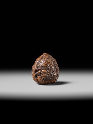 Lot 334 - TORYUSAI KOZAN: A SUPERB KURUMI (WALNUT) NETSUKE OF A DRAGON, DATED 1848