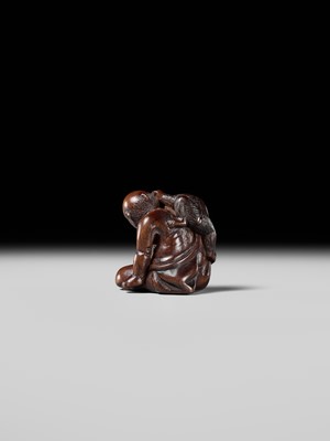 Lot 219 - MIWA: AN AMUSING WOOD NETSUKE OF A SARUMAWASHI WITH MONKEY