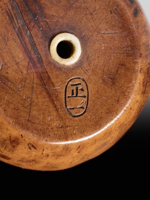 Lot 471 - MASAKAZU: A WOOD NETSUKE OF A TETSUBIN ON A HIBACHI