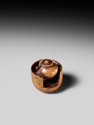 Lot 471 - MASAKAZU: A WOOD NETSUKE OF A TETSUBIN ON A HIBACHI