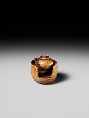 Lot 471 - MASAKAZU: A WOOD NETSUKE OF A TETSUBIN ON A HIBACHI