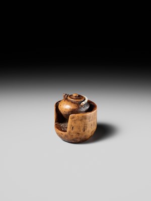 Lot 471 - MASAKAZU: A WOOD NETSUKE OF A TETSUBIN ON A HIBACHI