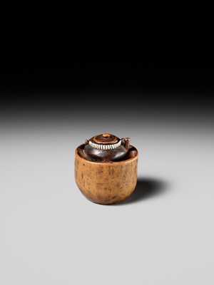 Lot 471 - MASAKAZU: A WOOD NETSUKE OF A TETSUBIN ON A HIBACHI