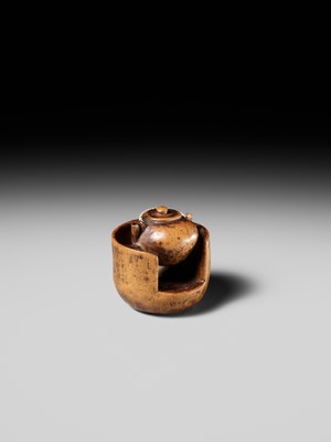 Lot 471 - MASAKAZU: A WOOD NETSUKE OF A TETSUBIN ON A HIBACHI