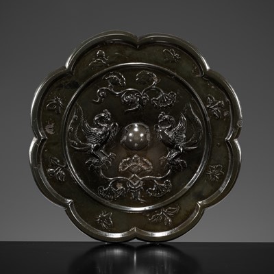 Lot 383 - AN EIGHT-LOBED ‘MYTHICAL BEASTS’ BRONZE MIRROR, TANG DYNASTY