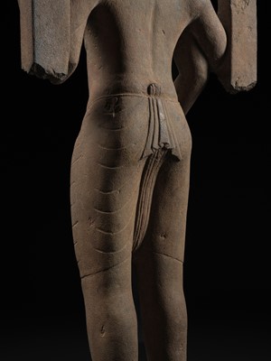 Lot 235 - A LARGE AND IMPRESSIVE SANDSTONE FIGURE OF HARIHARA, PRE-ANGKORIAN PERIOD, PHNOM DA STYLE