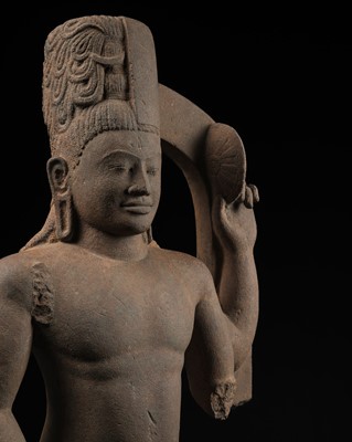 Lot 235 - A LARGE AND IMPRESSIVE SANDSTONE FIGURE OF HARIHARA, PRE-ANGKORIAN PERIOD, PHNOM DA STYLE