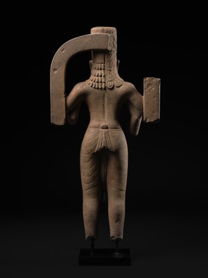 Lot 235 - A LARGE AND IMPRESSIVE SANDSTONE FIGURE OF HARIHARA, PRE-ANGKORIAN PERIOD, PHNOM DA STYLE