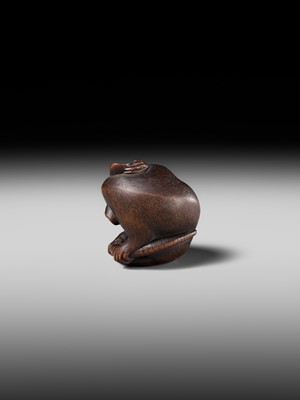 Lot 149 - MASAKAZU: A MASTERFUL WOOD NETSUKE OF A RAT GROOMING ITSELF