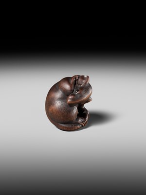 Lot 149 - MASAKAZU: A MASTERFUL WOOD NETSUKE OF A RAT GROOMING ITSELF