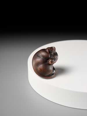 Lot 149 - MASAKAZU: A MASTERFUL WOOD NETSUKE OF A RAT GROOMING ITSELF