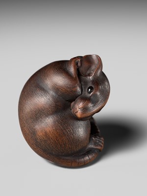 Lot 149 - MASAKAZU: A MASTERFUL WOOD NETSUKE OF A RAT GROOMING ITSELF