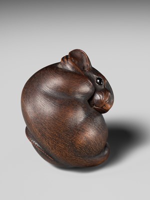 Lot 149 - MASAKAZU: A MASTERFUL WOOD NETSUKE OF A RAT GROOMING ITSELF