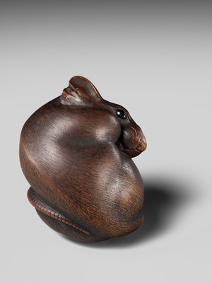 Lot 149 - MASAKAZU: A MASTERFUL WOOD NETSUKE OF A RAT GROOMING ITSELF