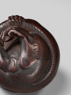 Lot 149 - MASAKAZU: A MASTERFUL WOOD NETSUKE OF A RAT GROOMING ITSELF