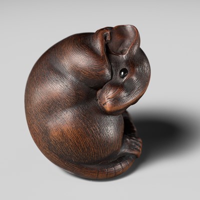 Lot 149 - MASAKAZU: A MASTERFUL WOOD NETSUKE OF A RAT GROOMING ITSELF