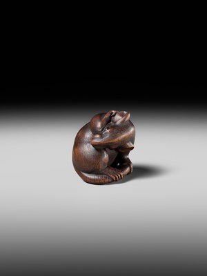 Lot 149 - MASAKAZU: A MASTERFUL WOOD NETSUKE OF A RAT GROOMING ITSELF