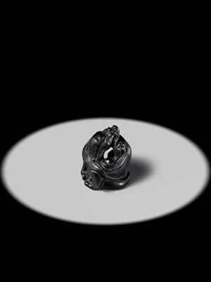 Lot 223 - HO RAKUMIN: A FINE EBONY WOOD NETSUKE OF A COILED AMARYU (RAIN DRAGON)