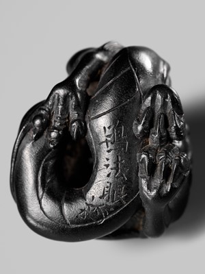 Lot 223 - HO RAKUMIN: A FINE EBONY WOOD NETSUKE OF A COILED AMARYU (RAIN DRAGON)