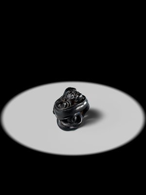 Lot 223 - HO RAKUMIN: A FINE EBONY WOOD NETSUKE OF A COILED AMARYU (RAIN DRAGON)