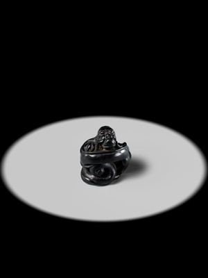 Lot 223 - HO RAKUMIN: A FINE EBONY WOOD NETSUKE OF A COILED AMARYU (RAIN DRAGON)