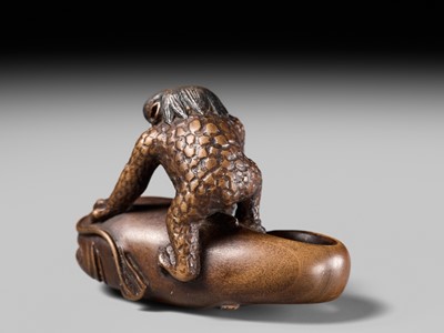 Lot 173 - ITTOKUSAI: A SUPERB WOOD NETSUKE OF A KAPPA AND NAMAZU (PARODY OF KADORI MYOJIN)