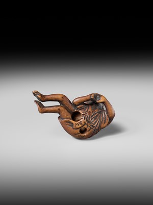 Lot 222 - JOBUN: A SUPERB WOOD NETSUKE OF A RECLINING MONKEY