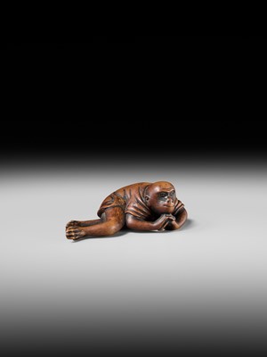 Lot 222 - JOBUN: A SUPERB WOOD NETSUKE OF A RECLINING MONKEY