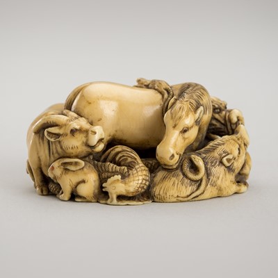 Lot 1413 - AN IVORY NETSUKE OF THE JUNISHI