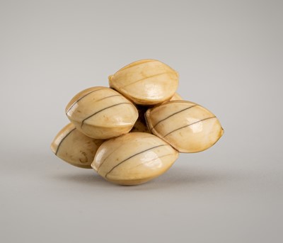 Lot 1315 - A FINE IVORY NETSUKE OF SIX GINKGO NUTS