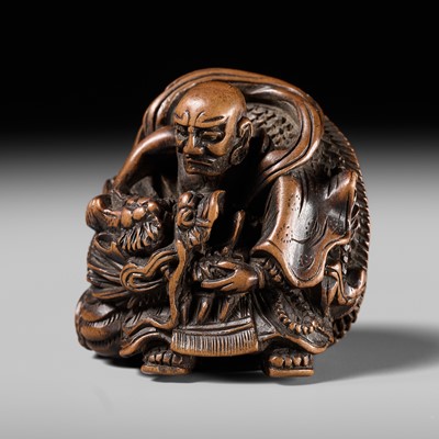 Lot 142 - MASATOMI: A RARE WOOD NETSUKE OF THE RAKAN HANDAKA SONJA AND HIS DRAGON