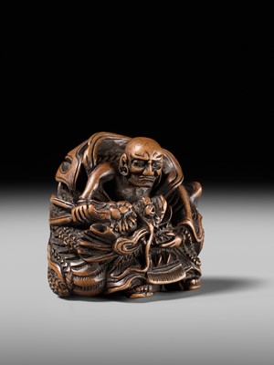 Lot 142 - MASATOMI: A RARE WOOD NETSUKE OF THE RAKAN HANDAKA SONJA AND HIS DRAGON