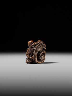 Lot 142 - MASATOMI: A RARE WOOD NETSUKE OF THE RAKAN HANDAKA SONJA AND HIS DRAGON