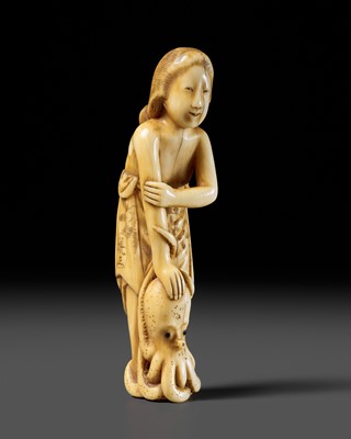 Lot 247 - CHIKAMASA: AN IVORY SHUNGA NETSUKE OF AMA WITH AN OCTOPUS