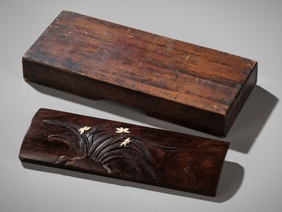 AN INLAID ZITAN ‘IRIS’ WRIST REST, QING DYNASTY