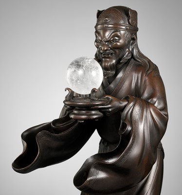 Lot 75 - AN IMPRESSIVE BRONZE OKIMONO OF RYUJIN PRESENTING A ROCK CRYSTAL SACRED JEWEL (YASAKANI NO NAGATAMA)