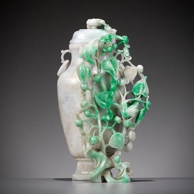 Lot 1779 - A LAVENDER AND EMERALD-GREEN JADEITE ‘BIRDS AND FLOWERS’ VASE AND COVER